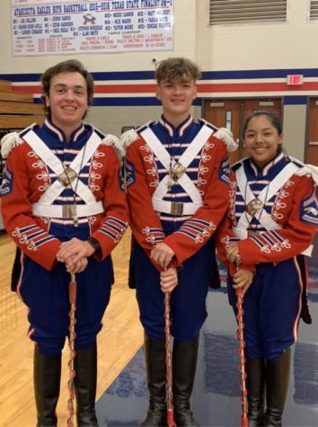 Maguire Emswiler (left), Mason Stump (center) and Marissa Estrada (right) are this years drum majors. Emswiler is a senior trumpet player.
