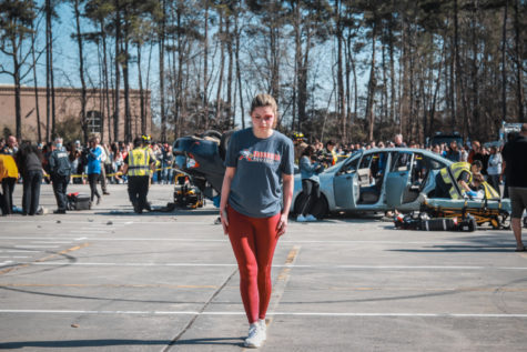 Senior Amy Koch acts as the drunk driver and attempts to walk a straight line.