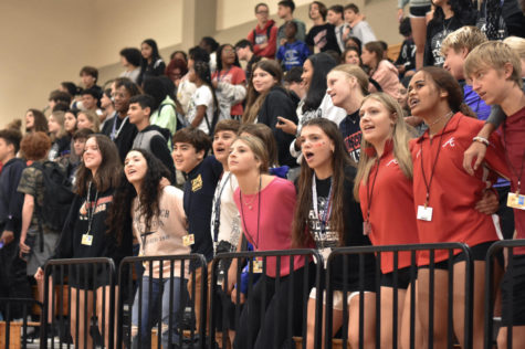 Freshmen learn the school chants from the student council.