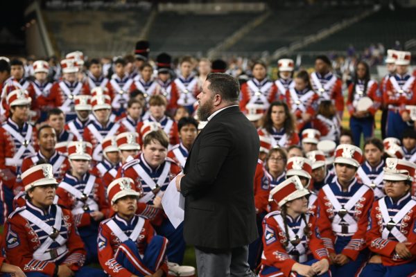 Band director Brian Best, talks to band students after receiving their award at state.