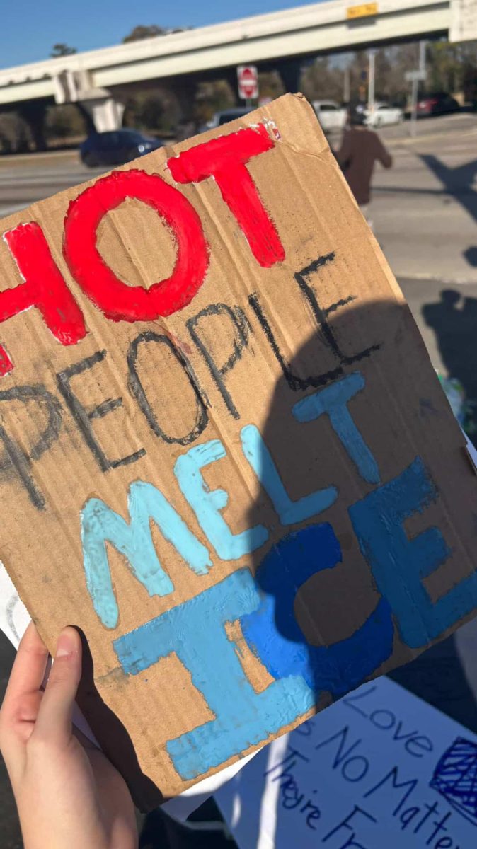 A sign titled "HOT PEOPLE MELT ICE" used in a protest against the U.S. Immigration and Customs Enforcement (ICE) program.
