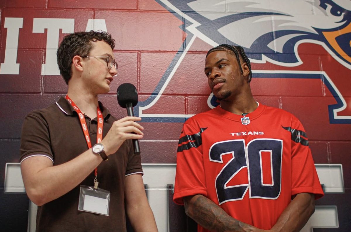 (Left to right) Senior Henry Lazarus interviews Houston Texans cornerback Ja'Marcus Ingram about his pro football career and his preceding college and high school years. Junior Gianna Bellinfantie and junior Francis Muniz also interviewed Ingram.